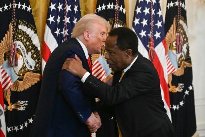 US President Donald Trump shakes hands with Leo Terrell