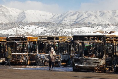Buses that were burnt at a depot during recent public protests, in Tehran on January 21, 2026