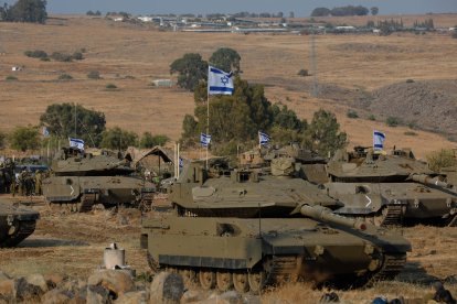 Israeli Merkava tanks are positioned in the upper Galilee in northern Israel near the border with Lebanon (Files)