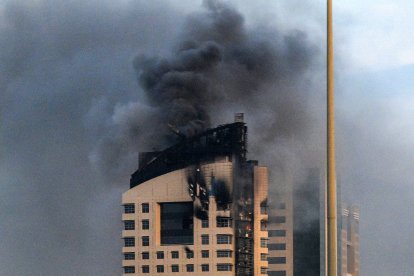 Smoke rises from a high-rise building following a drone attack in Kuwait City