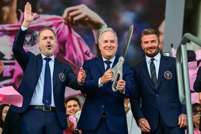 (L-R) Inter Miami co-owner, Jose Mas, managing owner Jorge Mas, and co-owner David Beckham, participate in the ribbon-cutting during the inauguration of the teams new headquarters, the Nu Stadium, in Miami, on April 4, 2026. (Photo by Giorgio VIERA / AFP)