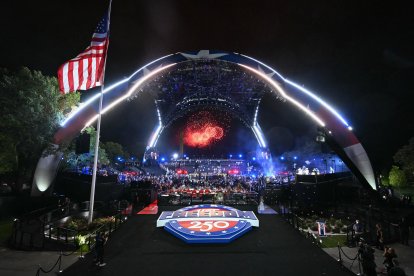 Fireworks go off as America's Justin Gaethje celebrates after defeating Georgia's Ilia Topuria during "UFC Freedom 250"