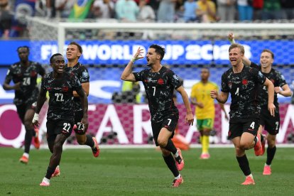 Los jugadores canadienses celebran la clasificación ante Sudáfrica/ Patrick T. Fallon