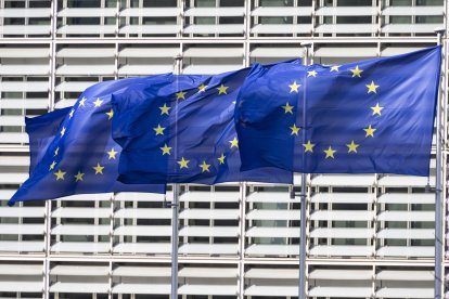 Flags of Europe as seen waving from the flagpoles in front of the EU Commission headquarters.