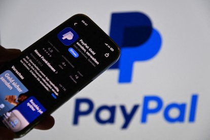 Offer available: Paypal is apparently up for sale. A smartphone displays the PayPal app in the App Store in front of a blurry monitor with the PayPal logo ?SVEN SIMON Photo Agency GmbH & Co. Press Photo KG # Seidlhofstr.10 # 85540 Haar # GLS Bank IBAN (Photo by Frank Hoermann / SVEN SIMON / SVEN SIMON / dpa Picture-Alliance via AFP)