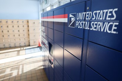 USPS Smart Lockers for package pickup stand in the lobby of the United States Postal Service (USPS)