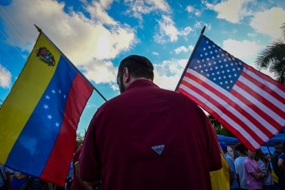 Opponents of ousted Venezuelan President Nicolas Maduro demonstrate in Doral, Florida, on January 4, 2026. Venezuela's deposed president Nicolas Maduro is scheduled to appear before a federal judge in New York at noon on January 5, to be formally notified about the charges against him, the court said. Maduro and his wife, Cilia Flores, were seized by US forces during a pre-dawn raid on January 3 in Caracas and brought to New York to face charges of "narcoterrorism" tied to alleged trafficking of tons of cocaine into the United States. (Photo by GIORGIO VIERA / AFP)