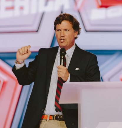 Conservative political commentator and podcast host Tucker Carlson speaks at Turning Point's annual AmericaFest conference, in remembrance of late right-wing political activist Charlie Kirk, in Phoenix, Arizona on December 18, 2025.
Kirk was shot dead on a Utah college campus in September, sparking a wave of grief among conservatives, and threats of a clampdown on the