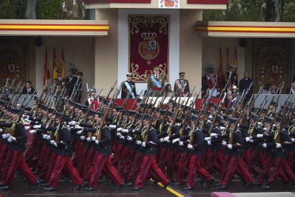 King Felipe VI watches the military parade with Princess Leonor.