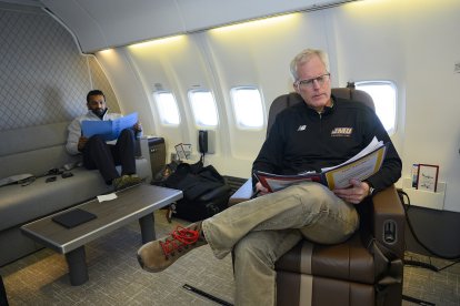 Defense Secretary Chris Miller works on a government aircraft with Chief of Staff Kash Patel