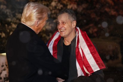 Marc Fogel, released from a Russian dungeon, greets the president.
