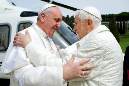 Francis embraces then pope emeritus, Benedict XVI.