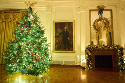 Christmas trees decorate the East Room of the White House.