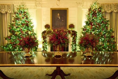 Christmas trees decorate the White House State Dining Room.