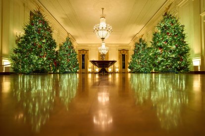 Christmas trees decorate the East Room of the White House.
