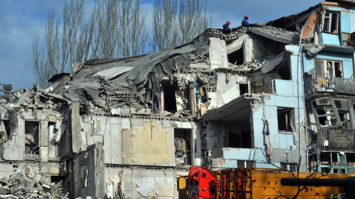 Rescuers remove the rubble at an alartment block hit by the Russian missile on the night of March 2, 2023, Zaporizhzhia, southeastern Ukraine.