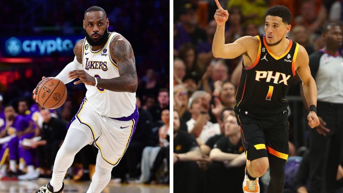LeBron James, jugador de Los Ángeles Lakers, y Devin Booker, jugador de Phoenix Suns, durante el tercer partido de las semifinales de los Playoffs de la NBA 2023.