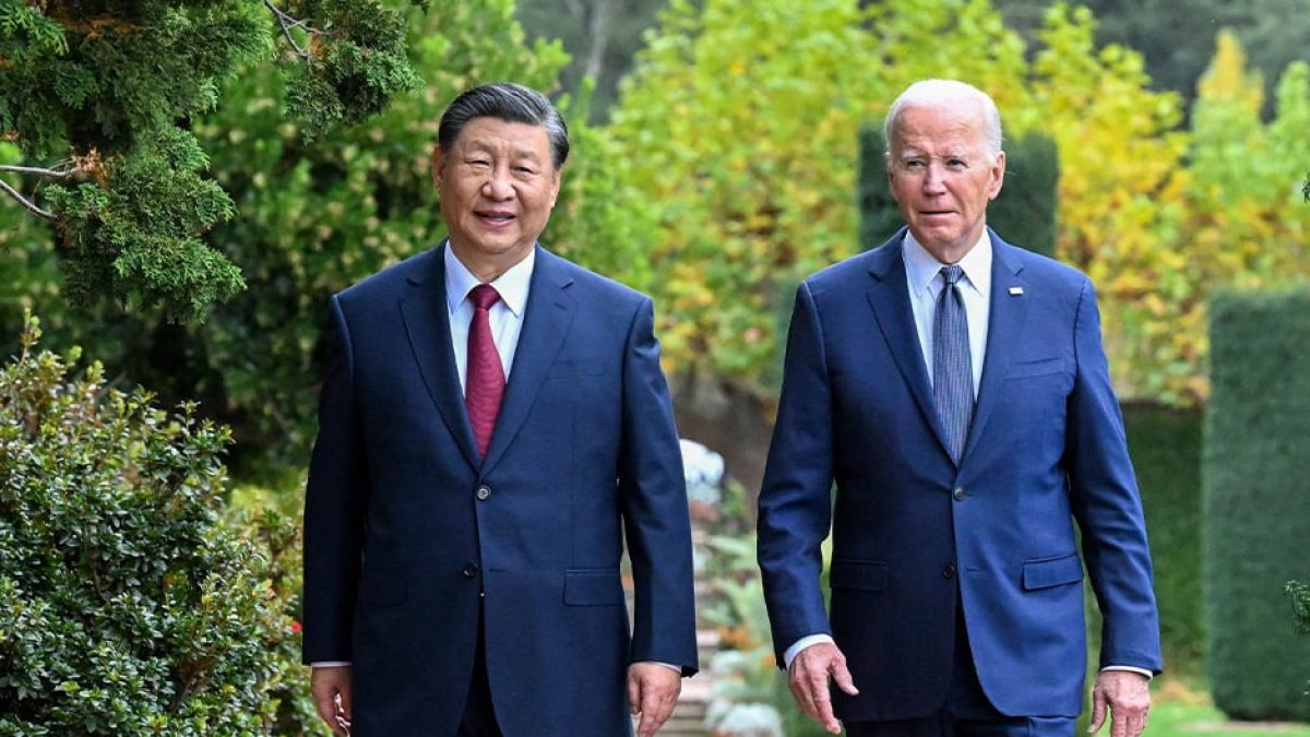 SAN FRANCISCO, Nov. 15, 2023 (Xinhua) -- Chinese President Xi Jinping and U.S. President Joe Biden take a walk after their talks in the Filoli Estate in the U.S. state of California, Nov. 15, 2023. Chinese President Xi Jinping and U.S. President Joe Biden on Wednesday had a candid and in-depth exchange of views on strategic and overarching issues critical to the direction of China-U.S. relations and on major issues affecting world peace and development. The meeting was held at Filoli Estate, a country house approximately 40 km south of San Francisco, California. (Xinhua/Li Xueren) (Photo by LI XUEREN / XINHUA / Xinhua via AFP)