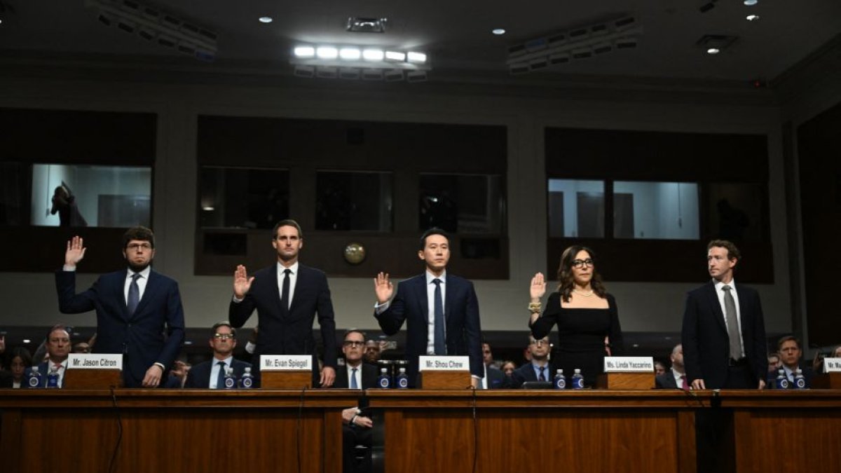 Jason Citron, CEO of Discord; Evan Spiegel, CEO of Snap; Shou Zi Chew, CEO of TikTok; Linda Yaccarino, CEO of X; and Mark Zuckerberg, CEO of Meta, are sworn in before testifying during the US Senate Judiciary Committee hearing, 