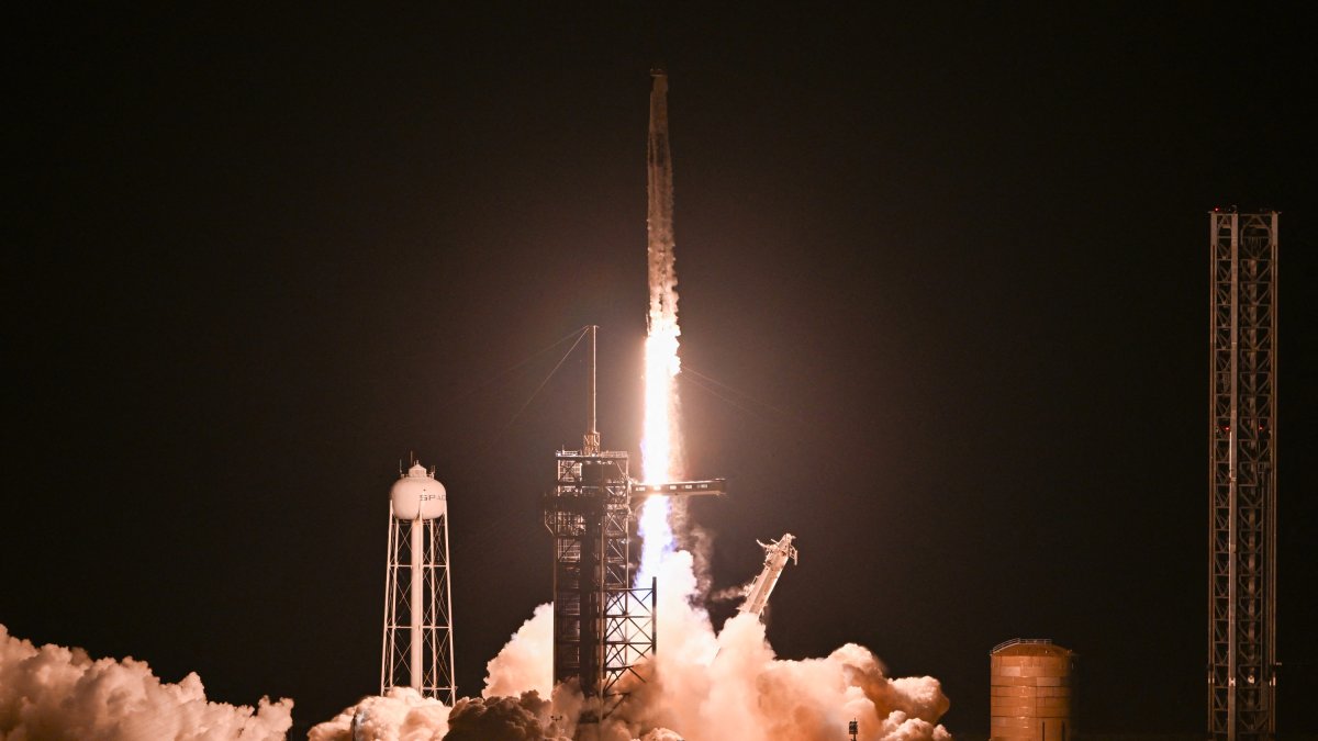 A SpaceX Falcon 9 rocket with the Crew Dragon Resilience capsule, carrying the crew of the Polaris Dawn Mission, lifts off from Launch Complex 39A at Kennedy Space Center in Cape Canaveral, Florida, on September 10, 2024. (Photo by CHANDAN KHANNA / AFP)