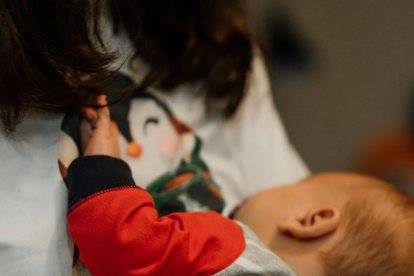A woman breastfeeding her child