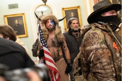 Jake Angeli the QAnon Shaman joins protesters as they storm the Capitol