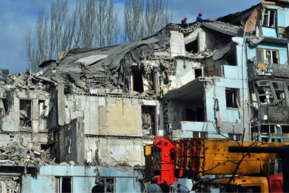 Rescuers remove the rubble at an alartment block hit by the Russian missile on the night of March 2, 2023, Zaporizhzhia, southeastern Ukraine.