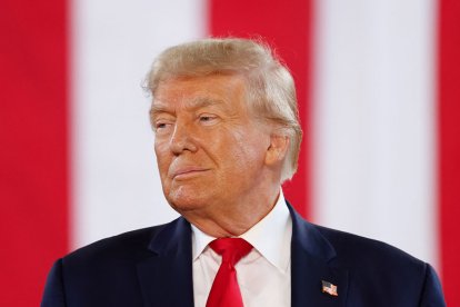 Former US President and 2024 Presidential hopeful Donald Trump arrives to speak during a Team Trump Iowa Commit to Caucus event at the National Cattle Congress in Waterloo, Iowa, on October 7, 2023. (Photo by KAMIL KRZACZYNSKI / AFP)