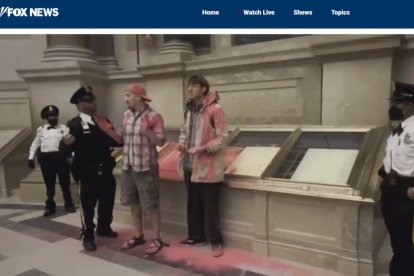 National Archives Rotunda evacuated after climate activists dump pink powder on case holding US Constitution