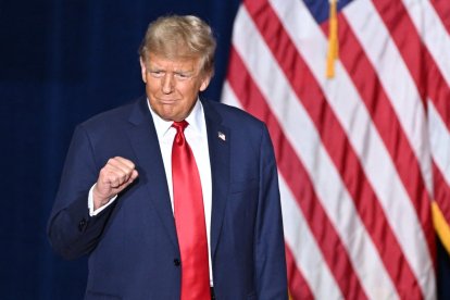 US President and Republican presidential hopeful Donald Trump arrives at a watch party during the 2024 Iowa Republican presidential caucuses in Des Moines, Iowa, on January 15, 2024. - Trump told Americans Monday 