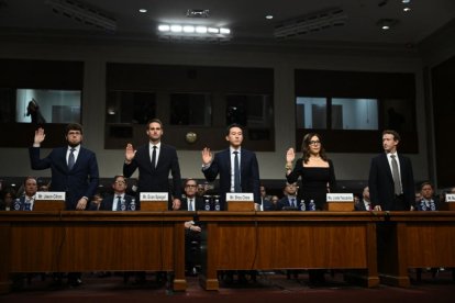 Jason Citron, CEO of Discord; Evan Spiegel, CEO of Snap; Shou Zi Chew, CEO of TikTok; Linda Yaccarino, CEO of X; and Mark Zuckerberg, CEO of Meta, are sworn in before testifying during the US Senate Judiciary Committee hearing, 