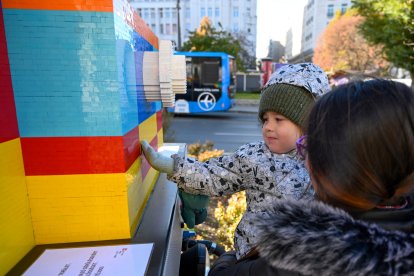 A child plays with a Lego exhibit in Hungary.