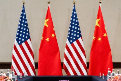 U.S. and Chinese flags at bilateral meeting