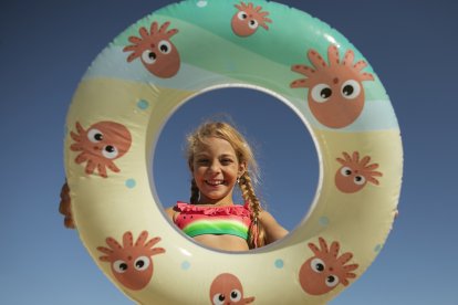 A little girl has fun at a Texas water park.