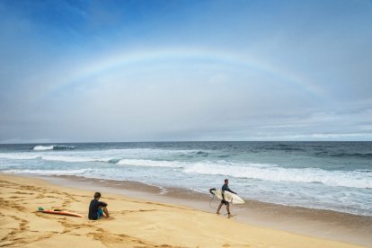 Surfers on a beach in Hawaii