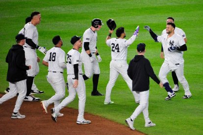 Yankees players celebrate the win
