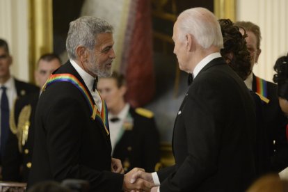 George Clooney and Joe Biden during an event at the White House in 2022