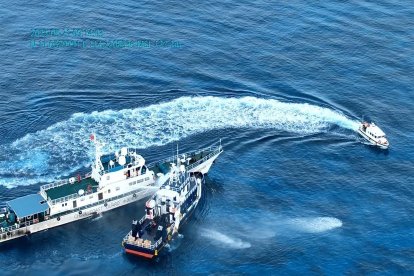 Chinese vessel deploying water cannons against Philippine vessels.