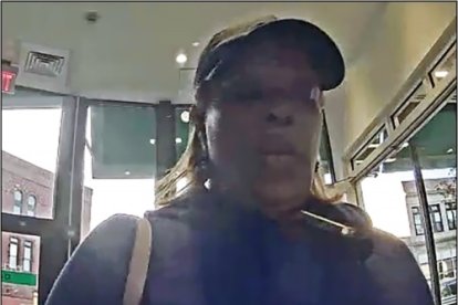 Colombian woman under security cameras.