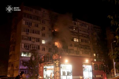 Building in flames after Russian attack in Ukraine.