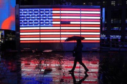 A person walks with an umbrella in Times Square (file image).