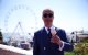 Reform UK leader Nigel Farage eats a 99 Flake ice cream in Clacton-on-Sea, eastern England, on July 4, 2024 as Britain holds a general election. (Photo by HENRY NICHOLLS / AFP)