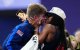 Gold medallist US' Hunter Woodhall (L) celebrates with his wife Olympic women's long jump champion Tara Davis-Woodhall after the victory ceremony for the Men's 400m T62 final event at the Stade de France in Saint-Denis, outside Paris on September 6, 2024. (Photo by Dimitar DILKOFF / AFP)