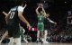 El alero de los Boston Celtics Jayson Tatum (0) lanza en suspensión durante la segunda parte contra el escolta de los Portland Trail Blazers Matisse Thybulle (4) en el Moda Center.
