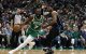 Apr 23, 2025; Boston, Massachusetts, USA; Boston Celtics guard Jaylen Brown (7) drives past Orlando Magic center Wendell Carter Jr. (34) during the second half of game two of the first round of the 2024 NBA Playoffs at TD Garden