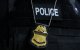 Chapa policial de un agente de Inmigración