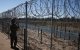 A US Army soldier monitors the US-Mexico border in Eagle Pass, Texas, on January 24, 2025. US President Donald Trump ordered 1,500 more active military personnel to the border with Mexico as part of a flurry of steps to tackle immigration, his spokeswoman said on January 22. Border security is a key priority for the president, who declared a national emergency at the US frontier with Mexico on his first day in office, and the additional personnel will bring the total number of active-duty troops deployed there to around 4,000. (Photo by CHARLY TRIBALLEAU / AFP)