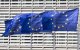 Flags of Europe as seen waving from the flagpoles in front of the EU Commission headquarters.