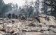 Los escombros de una vivienda residencial calcinada siguen ardiendo lentamente en el barrio de Balboa, en Spokane (Washington), el 2 de agosto de 2026. Los incendios, que avanzaron a gran velocidad, dejaron un rastro de destrucción el domingo en la ciudad de Spokane, situada en el noroeste de Estados Unidos, y las autoridades informaron de que cientos de edificios quedaron reducidos a cenizas.