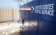 USPS Smart Lockers for package pickup stand in the lobby of the United States Postal Service (USPS)
